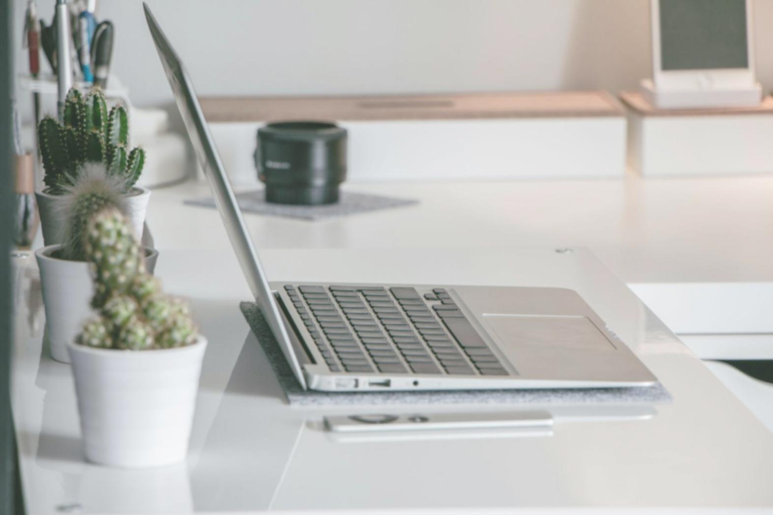 Calculator and financial documents spread on desk