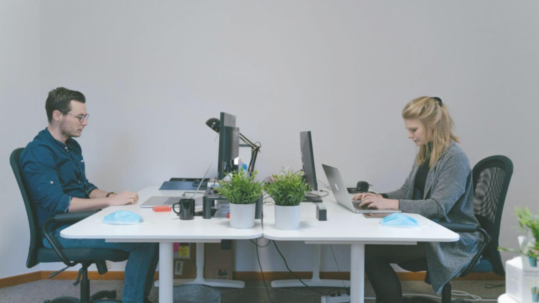 Family reviewing budget documents together at kitchen table